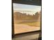 Scenic view of the neighborhood from the home's lanai with a paved drive at 13830 Begonia Cir, Port Charlotte, FL 33981