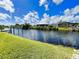 Scenic water view with lush green landscaping and neighborhood docks at 13830 Begonia Cir, Port Charlotte, FL 33981