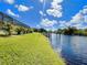 Serene water view showing the canal lined with palm trees and private docks at 13830 Begonia Cir, Port Charlotte, FL 33981