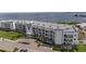 Elevated view of luxurious condos with waterfront location and well-maintained landscaping at 1425 Park Beach Cir # 1310, Punta Gorda, FL 33950