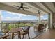 Inviting balcony with comfortable seating, ceiling fans, and beautiful bay views at 1425 Park Beach Cir # 1310, Punta Gorda, FL 33950