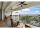 Cozy balcony with scenic views, ceiling fans, and comfortable seating area for relaxation at 1425 Park Beach Cir # 1310, Punta Gorda, FL 33950