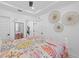 Cozy bedroom with neutral decor and light-colored walls, featuring multiple closets and entryways at 1425 Park Beach Cir # 1310, Punta Gorda, FL 33950