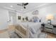 Charming bedroom features coastal decor, light hardwood floors, and a cozy writing nook at 1425 Park Beach Cir # 1310, Punta Gorda, FL 33950