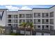 Attractive exterior of a multi-story building with balconies and lush tropical landscaping at 1425 Park Beach Cir # 1310, Punta Gorda, FL 33950