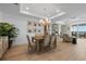 Cozy dining area with stylish decor, chandelier, and easy access to outdoor balcony at 1425 Park Beach Cir # 1310, Punta Gorda, FL 33950