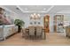 Bright dining room with a classic table setting, chandelier, and adjacent living spaces at 1425 Park Beach Cir # 1310, Punta Gorda, FL 33950