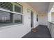 Exterior view of the unit's entrance with a well-lit walkway and clear unit number signage at 1425 Park Beach Cir # 1310, Punta Gorda, FL 33950