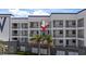 Modern condo building with private balconies and well-maintained landscaping at 1425 Park Beach Cir # 1310, Punta Gorda, FL 33950