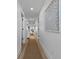 Bright hallway with hardwood floors, recessed lighting, and decorative wall art at 1425 Park Beach Cir # 1310, Punta Gorda, FL 33950