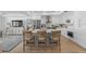 Bright, modern kitchen with island seating and stainless appliances, seamlessly connecting to the living area at 1425 Park Beach Cir # 1310, Punta Gorda, FL 33950