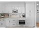 Classic white kitchen with ample cabinetry, stainless appliances, and modern countertop at 1425 Park Beach Cir # 1310, Punta Gorda, FL 33950