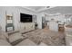 Inviting living room flows into a modern kitchen, creating an open and airy living space at 1425 Park Beach Cir # 1310, Punta Gorda, FL 33950