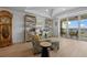 Bright office space with outdoor balcony access featuring charming decor and plenty of natural light at 1425 Park Beach Cir # 1310, Punta Gorda, FL 33950