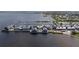 Aerial view of waterfront with docks, boat slips, and waterfront dining at 1425 Park Beach Cir # 1310, Punta Gorda, FL 33950
