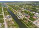 A wide shot showing a planned waterfront community with canals meandering throughout, creating tranquil and scenic settings at 15104 Aldama Cir, Port Charlotte, FL 33981