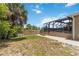 Expansive backyard with a screened-in lanai, perfect for outdoor entertaining and enjoying the serene water views at 15104 Aldama Cir, Port Charlotte, FL 33981