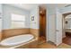 Bathroom with tiled soaking tub, tiled shower, and tiled floor at 15104 Aldama Cir, Port Charlotte, FL 33981