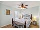 Bedroom featuring a ceiling fan, a comfortable bed, and hardwood floor at 15104 Aldama Cir, Port Charlotte, FL 33981