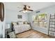 Bedroom with a window and a ceiling fan at 15104 Aldama Cir, Port Charlotte, FL 33981