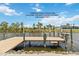 This stunning composite dock features water, electric and a fish cleaning station and a 7,500 lb boat lift at 15104 Aldama Cir, Port Charlotte, FL 33981