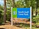 South Gulf Cove Park sign, lush greenery, marking the entrance to the community park at 15104 Aldama Cir, Port Charlotte, FL 33981