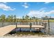 Enjoy waterfront living with this private dock including boat lift and sitting area at 15104 Aldama Cir, Port Charlotte, FL 33981