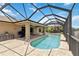 Enjoy the lovely pool with the screened enclosure and views of the lake at 15104 Aldama Cir, Port Charlotte, FL 33981