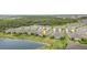 An aerial view showcases the home's position near a pond and lush green spaces in a beautiful neighborhood at 16965 Hawk Ct, Punta Gorda, FL 33982