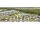 Aerial view of the neighborhood showcasing the house's location, lush landscaping, and nearby lakes and natural preserves at 16965 Hawk Ct, Punta Gorda, FL 33982