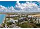 Beautiful aerial view of community buildings and amenities with lush landscaping and open green spaces at 16965 Hawk Ct, Punta Gorda, FL 33982