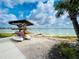 Lakeside view with paddle boats, kayak rentals, and dock for waterfront enjoyment at 16965 Hawk Ct, Punta Gorda, FL 33982
