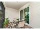 Cozy screened patio with brick flooring, a glass table with seating for four, and sliding glass door access at 16965 Hawk Ct, Punta Gorda, FL 33982