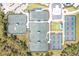 Overhead view of tennis and pickleball courts, well-maintained and ready for a match in a green setting at 17557 Santorini Ct, Venice, FL 34293