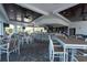 Spacious clubhouse with ample seating, a bar area, and an inviting atmosphere for social gatherings at 17557 Santorini Ct, Venice, FL 34293