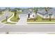 Charming single-Gathering home with a gray roof, well-manicured lawn, and attractive landscaping at 17557 Santorini Ct, Venice, FL 34293