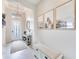 Bright foyer with high ceilings, decorative art, and a welcoming entrance for guests and residents alike at 17557 Santorini Ct, Venice, FL 34293