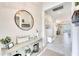 Inviting foyer featuring stylish decor, light colors, and tile flooring, creating a warm welcome at 17557 Santorini Ct, Venice, FL 34293