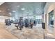 Bright gym with modern equipment, carpeted floors, and lots of natural light from surrounding windows at 17557 Santorini Ct, Venice, FL 34293