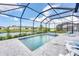 Relaxing pool with a spa overlooking a serene water view, perfect for unwinding after a long day at 17557 Santorini Ct, Venice, FL 34293