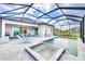 A screened-in pool with a spa and outdoor seating areas for a relaxing outdoor experience at 17557 Santorini Ct, Venice, FL 34293