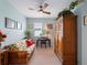 Charming bedroom with floral futon, desk, and decorative armoire at 17857 Woodland Ct, Punta Gorda, FL 33982
