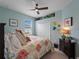 Cozy bedroom with a coastal theme, light blue walls, and carpet floors at 17857 Woodland Ct, Punta Gorda, FL 33982