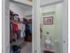 A large walk-in closet, with adjoining water closet, provides ample storage space at 17857 Woodland Ct, Punta Gorda, FL 33982