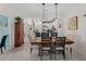 Open concept dining area with pendant lighting, a view to the kitchen, and plenty of natural light at 17857 Woodland Ct, Punta Gorda, FL 33982