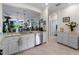 Kitchen with granite counters and stainless appliances, overlooking the dining and living areas at 17857 Woodland Ct, Punta Gorda, FL 33982