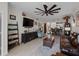 Open concept living room featuring tile floors, large ceiling fan and views of kitchen at 17857 Woodland Ct, Punta Gorda, FL 33982