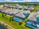 Aerial view of home with a screened pool and landscaping at 19821 Montenero Way, Venice, FL 34293