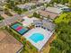 Aerial view of community pool, tennis court, and clubhouse at 19821 Montenero Way, Venice, FL 34293