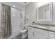 Cozy bathroom featuring a shower-tub combination and granite vanity at 19821 Montenero Way, Venice, FL 34293